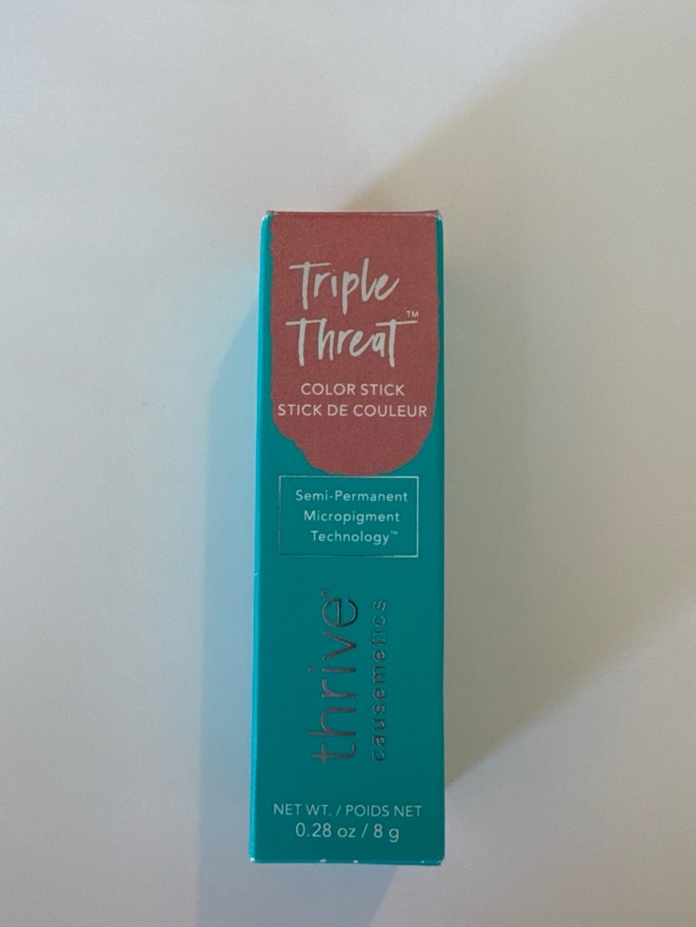 thrive causemetics Triple Threat Color Stick — Teal Box with Coral Label